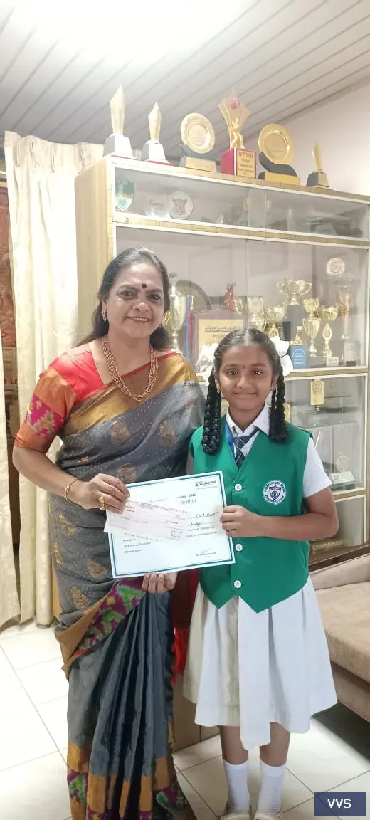 B.Veda Varshini participated in the Vignan s world one School.National Ramanujan
                  Championship.She is
